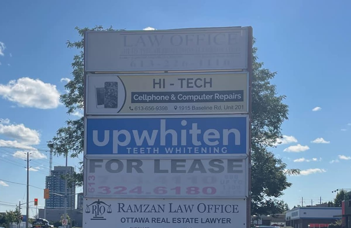 The UpWhiten Teeth Whitening panel on the roadside sign at 1915 Baseline Road, Ottawa